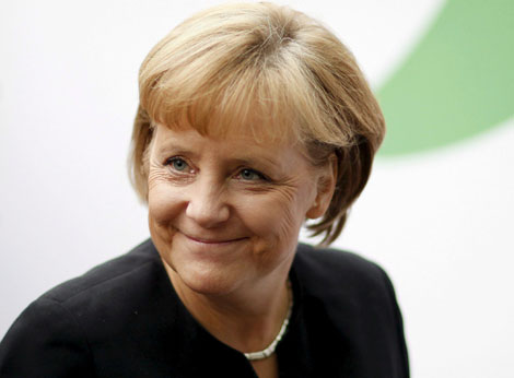 Merkel, satisfecha tras cerrar el acuerdo de Gobierno. | Efe