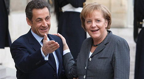 Merkel y Sarkozy en París