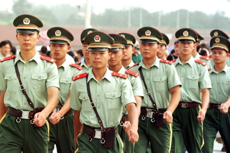 Miembros de la policía militar China.| Greg Baker